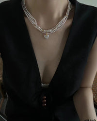 Multi-layer pearl necklace high-end design sense niche clavicle chain fashion personality